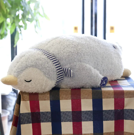 Plush animal pillow with soft fabric and cuddly round shape